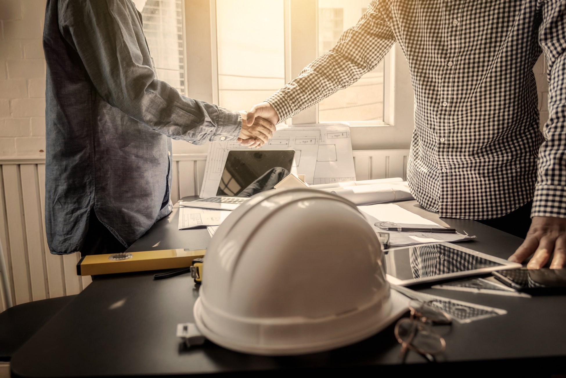 Shaking hand contractor engineer construction meeting business worker